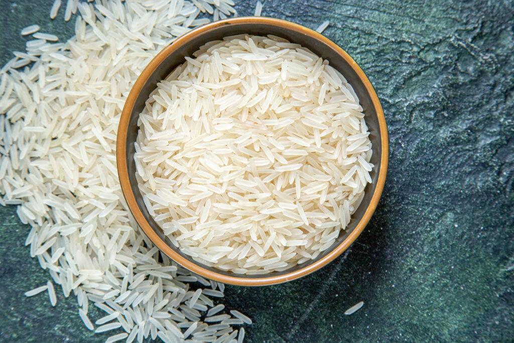 Top View Raw Rice Inside Plate Dark Desk 2 1024x683